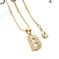 Macro shot of gold letter B pendant necklace with cubic zirconia and box chain detail - Letter B