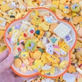 DIY cartoon resin charm set in vibrant yellow featuring assorted cute food and character shapes - Color Scheme By Weight - Warm Yellow Tones / Sold By Weight