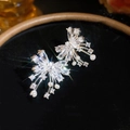 Elegant close-up of firework bow earrings featuring sparkling crystals and pearl accents - No.70 Butterfly Fireworks Artificial Pearl Style / Silver