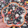 Mix of cartoon resin shoe charms including Kuromi and Mickey motifs in a bowl - Color Scheme By Weight - Elegant Black / Sold By Weight