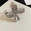 Detailed close-up of an oversized silver flower cuff with a textured, hammered metal finish. - Bracelet (4#)