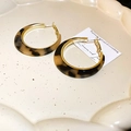 Elegant gold hoop earrings with tortoiseshell resin finish on a ceramic tray - Gold Alloy Tortoise Shell / 17# Silver Needle Round Resin Leopard Hoops