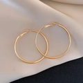 Polished large gold round hoop earrings with secure clasp on luxury satin background - Large Bright Gold Hoop / 25# Silver Needle Metal Hoop Earrings