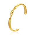 Detailed view of a gold-toned twisted C-shaped open cuff bangle with smooth finish - Triple Twist Design