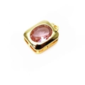 Macro view of a rectangular gold-plated pendant with a faceted pink crystal gemstone - Rectangle Style - Pink