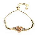 Macro detail of adjustable gold bracelet featuring pavé zircon heart and wing motifs - Heart Wings Multicolor Zircon Style(5) / Gold