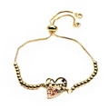 Macro shot of gold adjustable heart charm bracelet with multicolor stones and engraving - I Love You Heart Style(7) / Gold