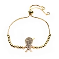 Close-up of gold adjustable bolo bracelet with micro-pave zircon boy pendant - Sitting Boy Style (4)