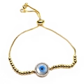 Macro shot of evil eye bracelet with blue zircon and adjustable gold-plated slider clasp - Round Style (10)