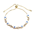 Close-up of adjustable Evil Eye slider bracelet with gold plating and blue enamel details - White
