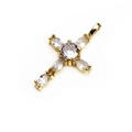 Macro detail of a gold plated cross pendant with brilliant clear zircon stone inlays - White