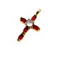 Detailed macro shot of a gold cross pendant with red marquise-cut stones and white zircon - Red