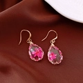 Macro detail of teardrop resin earrings with pink preserved flowers inside - Ear Hook - Gold / Rose Red