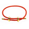 Detailed view of red woven cord bracelet with gold adjustable loops and ends - Orange Red
