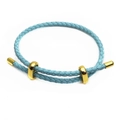 Detail of light blue braided leather bracelet with adjustable gold sliding metal clasps - Lake Blue