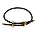Detail of adjustable black 3mm braided cord bracelet with polished gold-tone metal slides - Black
