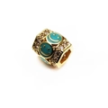 Macro view of a 14K gold-plated bead featuring micro-pave zircons and enamel smiley faces - Green Smiley Face