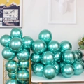 Bunch of shiny metallic teal green latex balloons for premium party decoration and events - Green