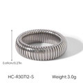 Detailed macro view of silver stainless steel elastic snake chain ring dimensions - Size 7 / Silver