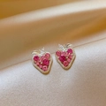 Close-up detail of strawberry-shaped earrings with sparkling pink zircon stones on silk. - Silver Earring Post - Pink / Pink