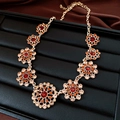 Detailed view of a vintage palace style necklace featuring red and orange crystals on gold - Chain Only (Without Pendant) / Gold Brown