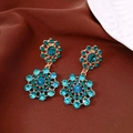 Detailed view of vintage palace-style drop earrings with teal rhinestones and gold setting. - Earrings Only (With Silver Earring Post) / Gold-Blue