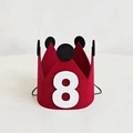 Macro detail of red felt birthday crown with number eight and elastic strap - Number 8