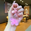 Portachiavi luminoso a forma di ciliegio rosa con sabbie mobili e campane - Stile Chiusura a Moschettone / Rosa