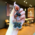 Portachiavi fiore di ciliegio in acrilico con sabbie mobili e campana in metallo nero - Stile Chiusura a Moschettone / Nero
