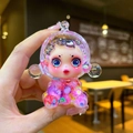 Detailed view of glow-in-the-dark little witch figurine with colorful liquid and sand - Large Luminous Bubble Bead Devil Girl / Iridescent