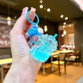 Dettaglio portachiavi a tazza iceberg blu luminoso con glitter liquidi e campanello - Blu