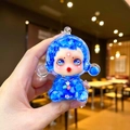 Detailed close-up of blue translucent witch figure with internal liquid and floral accents - Large Luminous Bubble Bead Devil Girl / Blue