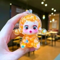 Close-up of cute cartoon witch pendant with orange resin shell and colorful flowers - Large Luminous Bubble Bead Devil Girl / Orange