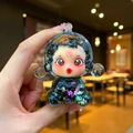 Detailed close-up of a glowing starry liquid doll pendant with purple glitter and flowers - 1 Piece / Large Luminous Bubble Bead Devil Girl (Black)