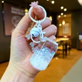 Handheld creative cola can keychain with glowing colorful beads and a white bell charm - Lobster Clasp Style / White