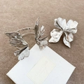 Close-up of sculptural silver metal flower ring and bracelet with wrinkled texture - 3D Floral Style (68#) / Silver