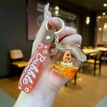 Detail van Capybara vloeibare olie sleutelhanger met glitters en siliconen band - Gradiënt Band / Houten Vis Capybara Huis