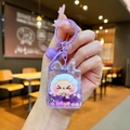 Detail of purple cartoon sheep liquid glitter keychain with metal bell and sequins - Purple Night Light Flashing Quicksand