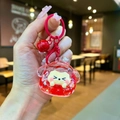 Detail of red quicksand charm with cute white animal figure and matching metal bell - Lobster Clasp Style / Noctilucent Flash Red Style