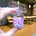 Close-up of a mini purple gas cylinder keychain with colorful beads and snowflake sequins - Snowflake Gas Tank / Purple Without Buckle