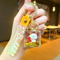 Detail of lucky cat keychain with golden quicksand and yellow strap in acrylic case - Gradient Strap Fortune Cat Cube