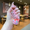 Pink sakura gas tank keychain with colorful beads and liquid glitter inside - Pink Gas Tank With Colorful Beads