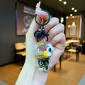 Dettaglio portachiavi creativo con sabbie mobili, glitter dorati e gancio in metallo nero - Stile Chiusura a Moschettone / Hardware Nero [Luna] Astronauta Nero Oro