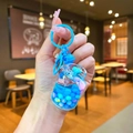 Blue acrylic liquid keychain in mini gas tank shape with floating beads and blue lobster clasp - Blue Gas Tank With Colorful Beads