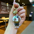 Detail of liquid oil astronaut keychain with star glitters and golden bell charm - Lobster Clasp Style / Gold Hardware [Planet] Black Gold Astronaut
