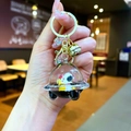 Cartoon astronaut dog keychain with liquid-filled UFO spaceship and golden bell charm - Lobster Clasp Style / Gold Hardware [Moon] Black Gold Spaceship