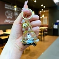 Cute astronaut UFO keychain with glitter, yellow star inside and golden bell accessory - Lobster Clasp Style / Gold Hardware [Rocket] Black Gold Spaceship