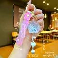 Pink Sakura cherry blossom liquid glitter keychain with swan charm and bell detail - Sakura Strap White Luminous Bubble Bead Bell