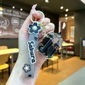 Detail of Sakura themed keychain with pink wristband and mini bubble tea cup pendant - Cherry Blossom Rope [black] Glow-in-the-dark Dried Flower Iceberg Cup