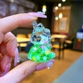 Close-up of a mini unicorn keychain charm with green liquid glitter and floral sequins - No Keychain / Green